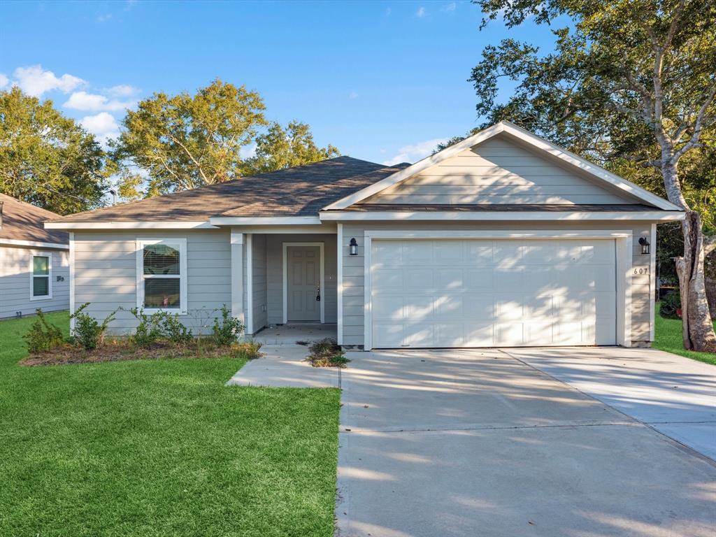 a front view of a house with a yard and porch