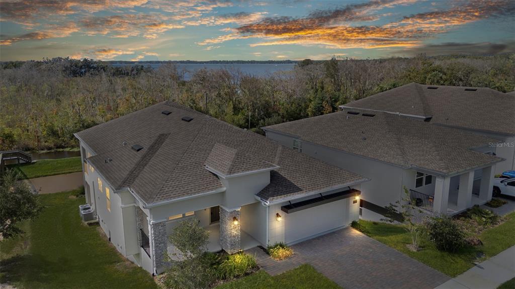 an aerial view of a house with mountain view