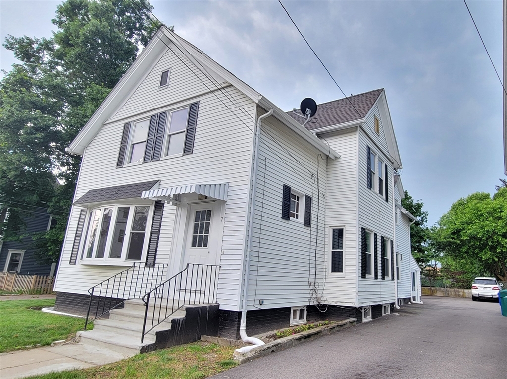 a view of front of house with a yard