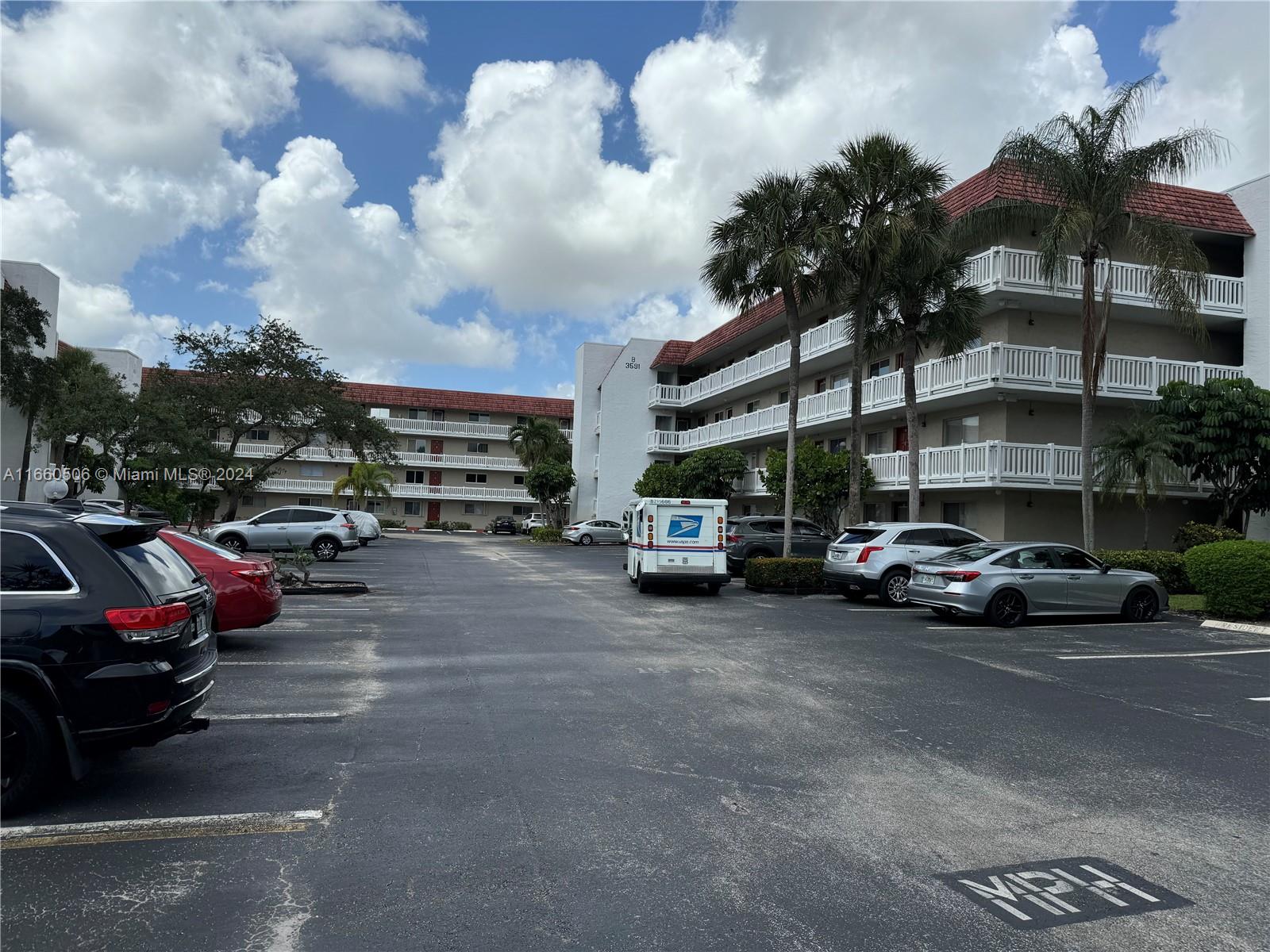 a view of street with parked cars