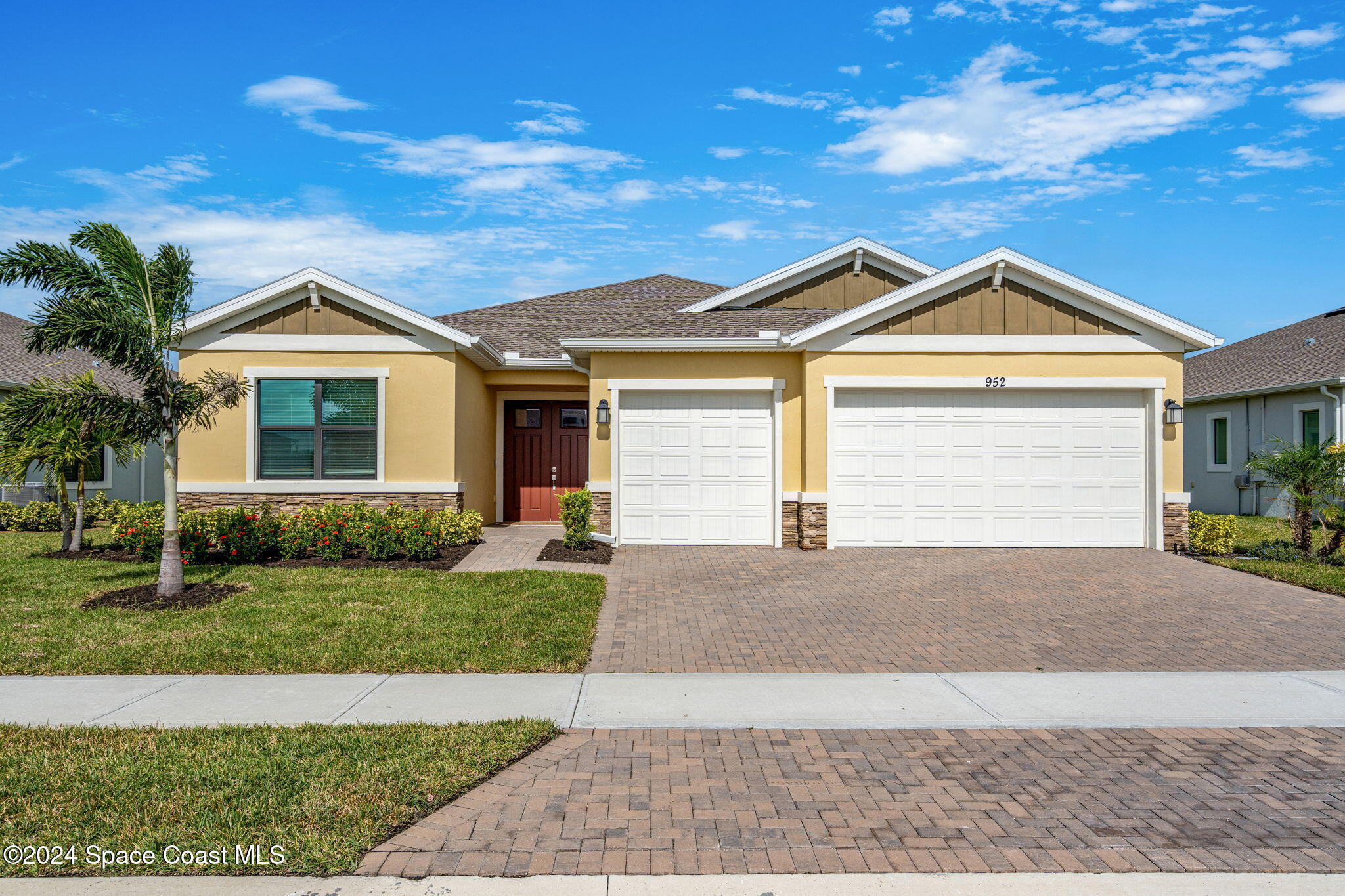 a front view of a house with a yard