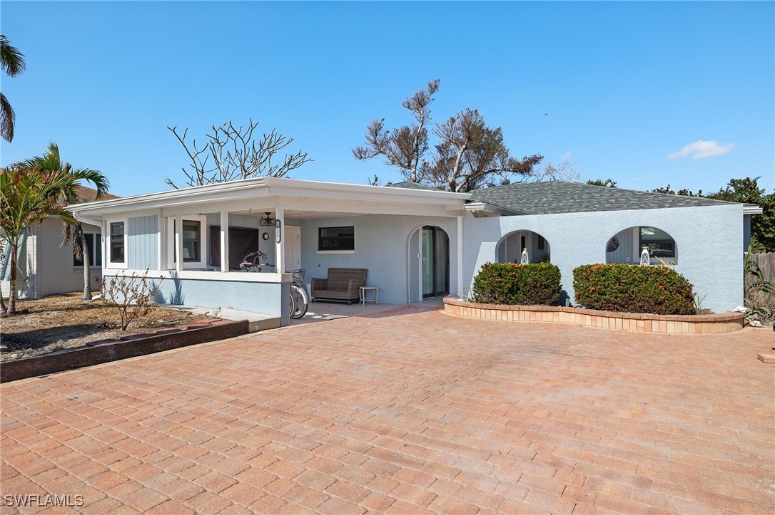 a front view of a house with garage