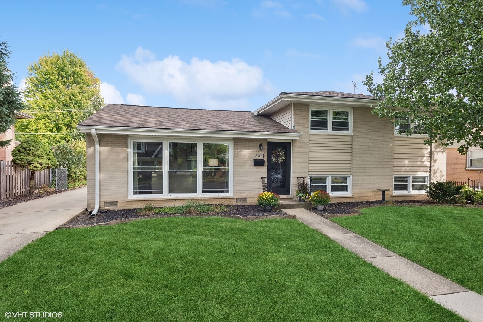 a house view with a garden space