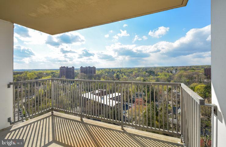 a view of a balcony with city view