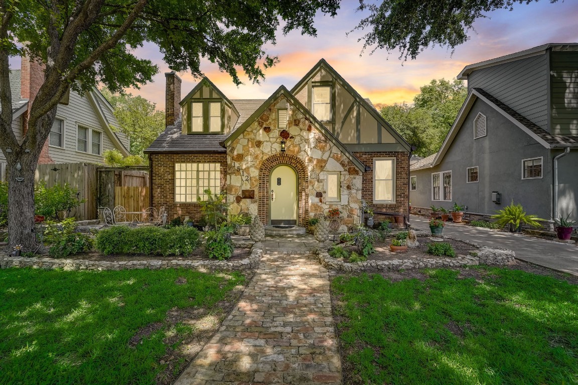 a front view of a house with garden