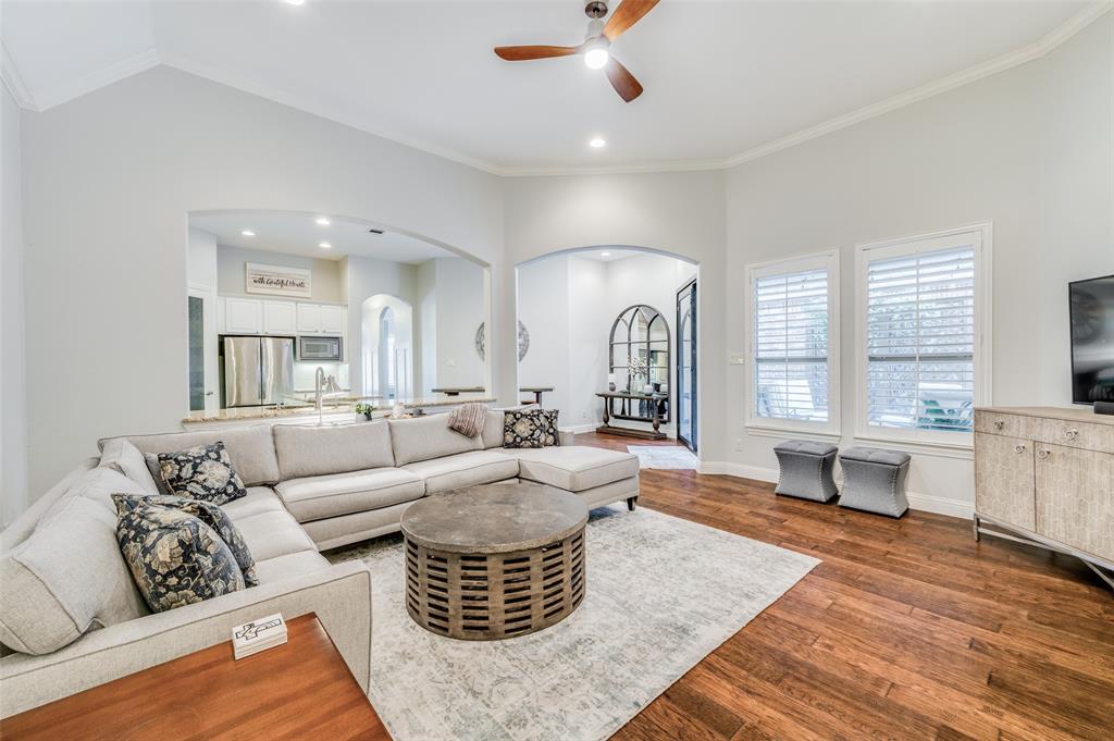 a living room with furniture or couch and a large window