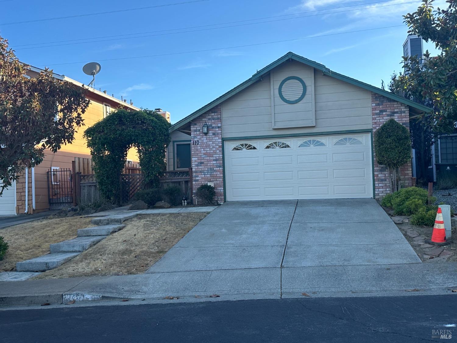 a front view of a house with parking space