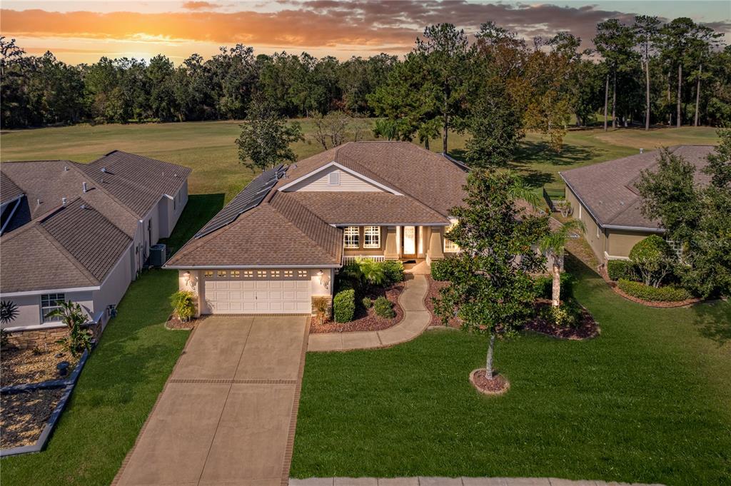 an aerial view of a house with a garden