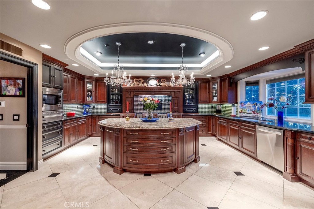 41 Done Deal boasts a gourmet chef kitchen with Viking 8 burner stove, restaurant grade exhaust, pasta server, double oven with center island bar and serving area along with a huge walk in pantry.
