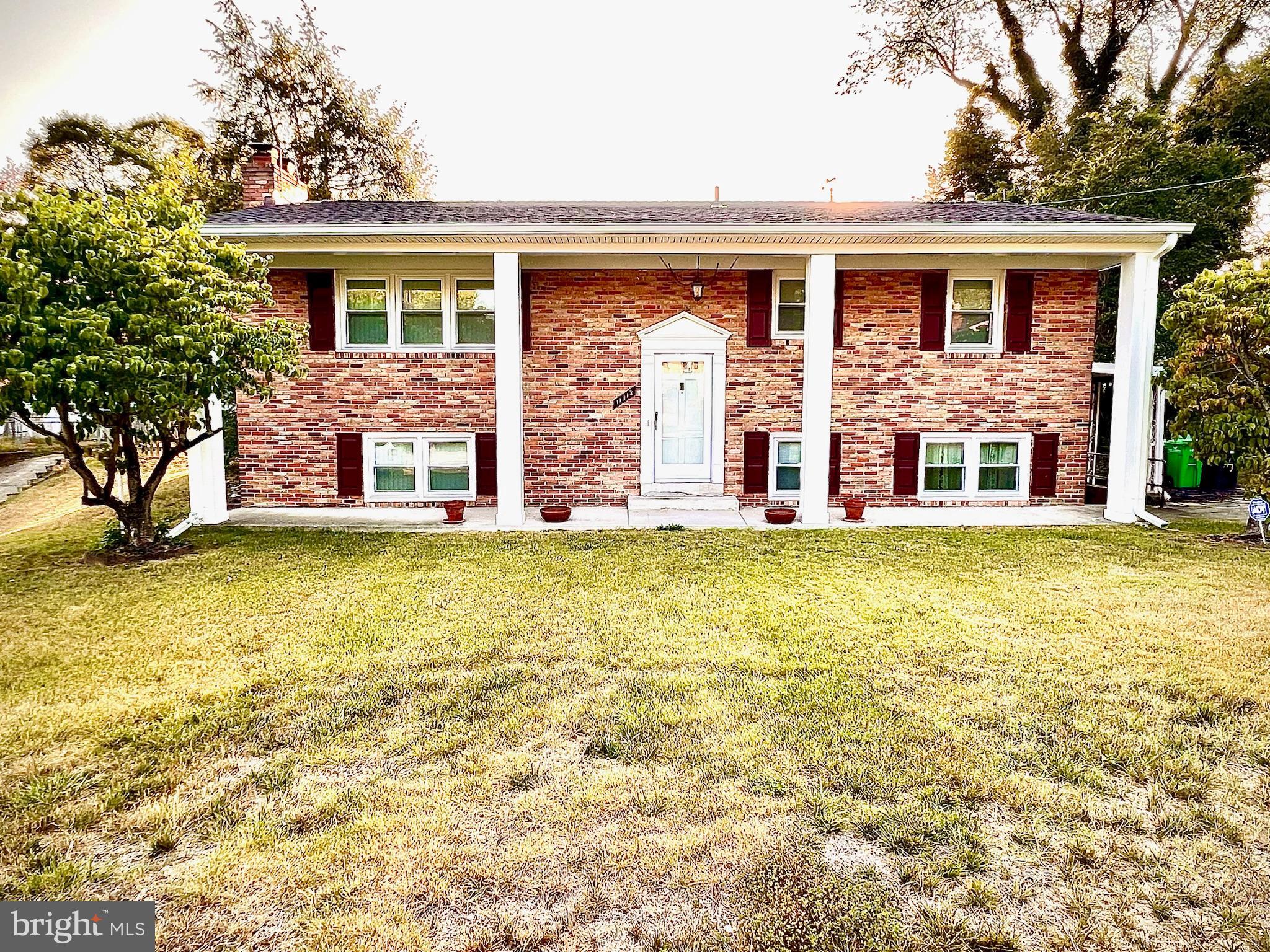 front view of a house with a yard