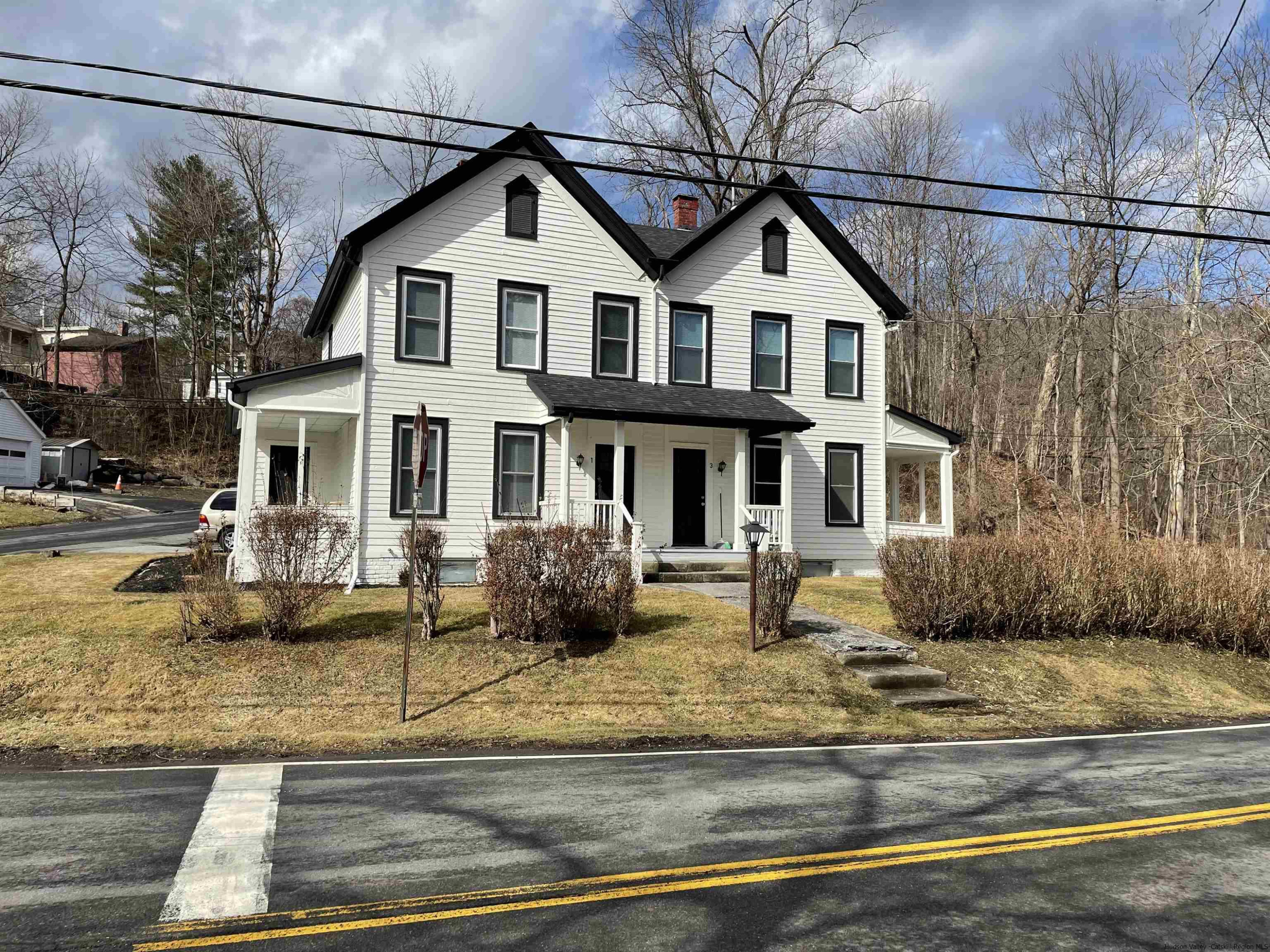 a front view of a house with garden