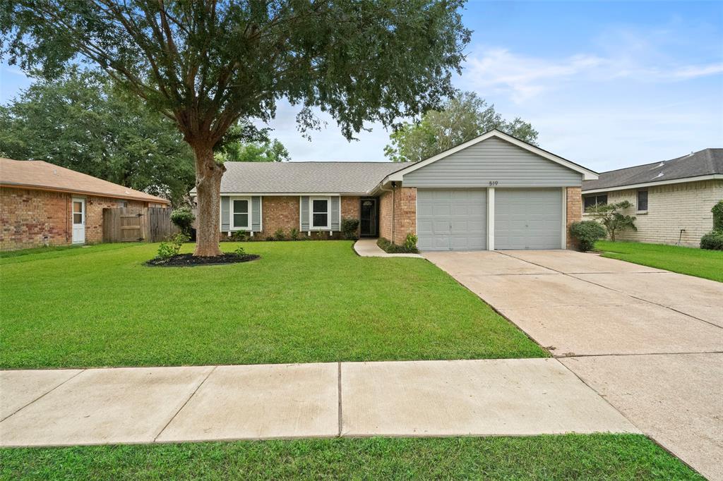 a view of house with a yard