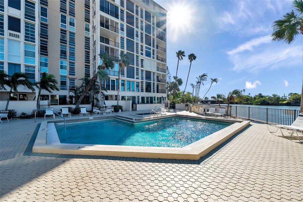 a view of swimming pool with outdoor seating