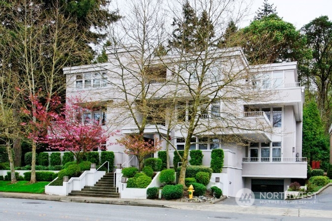 a front view of a building with garden