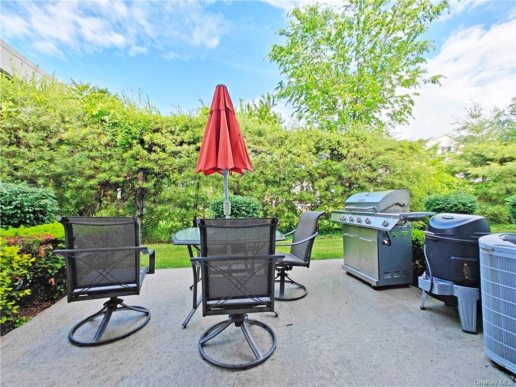 a view of a backyard with furniture and a tub