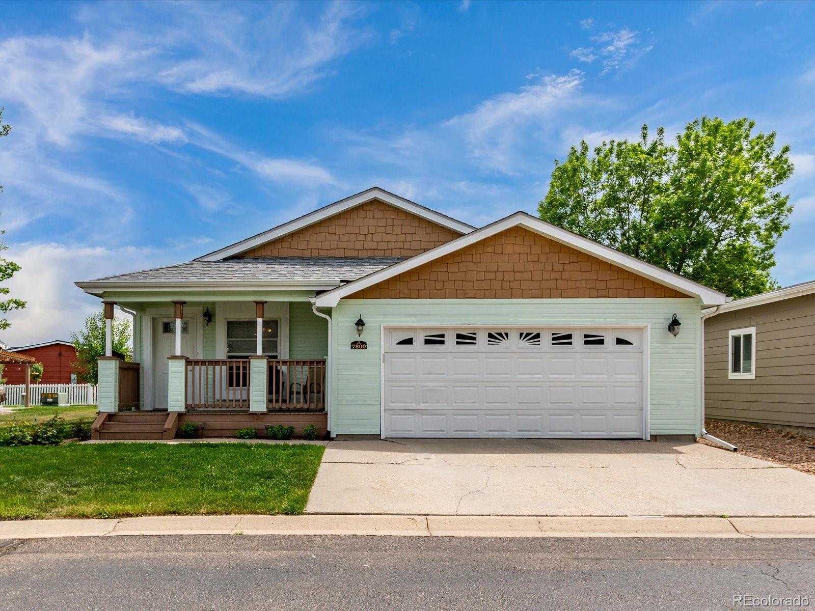 front view of a house with a small yard