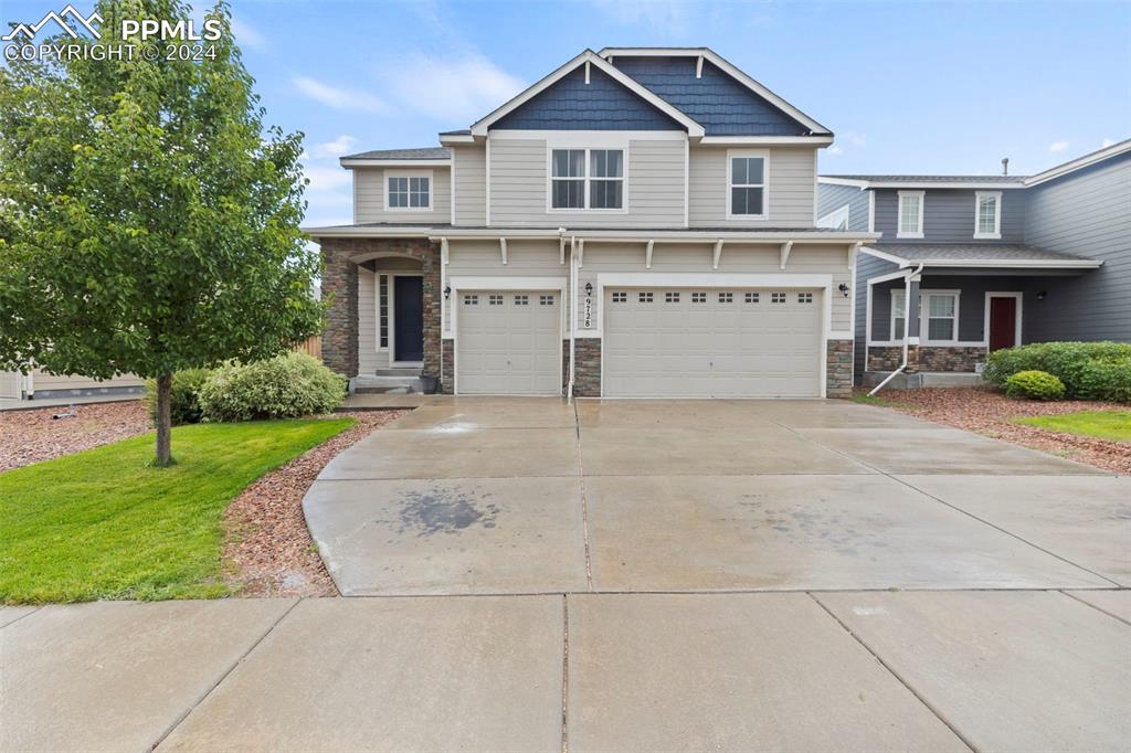 a view of house with yard and entertaining space