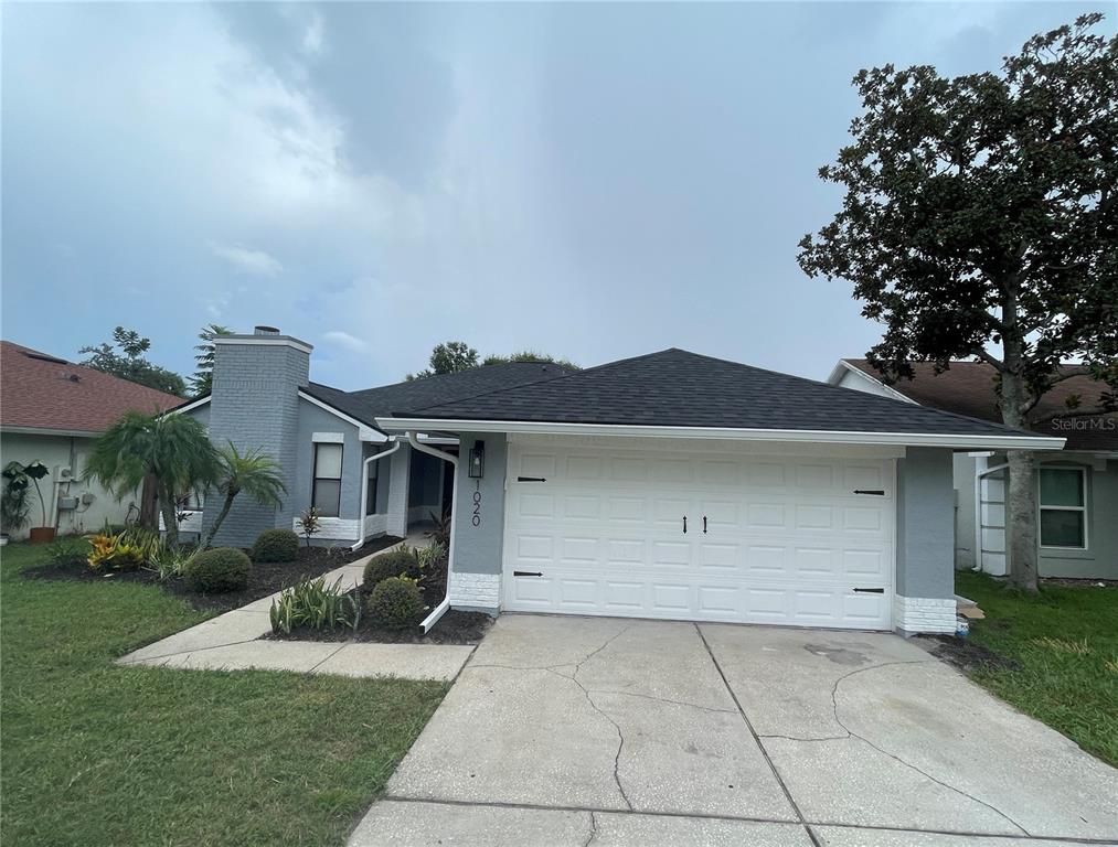 front view of house with a yard