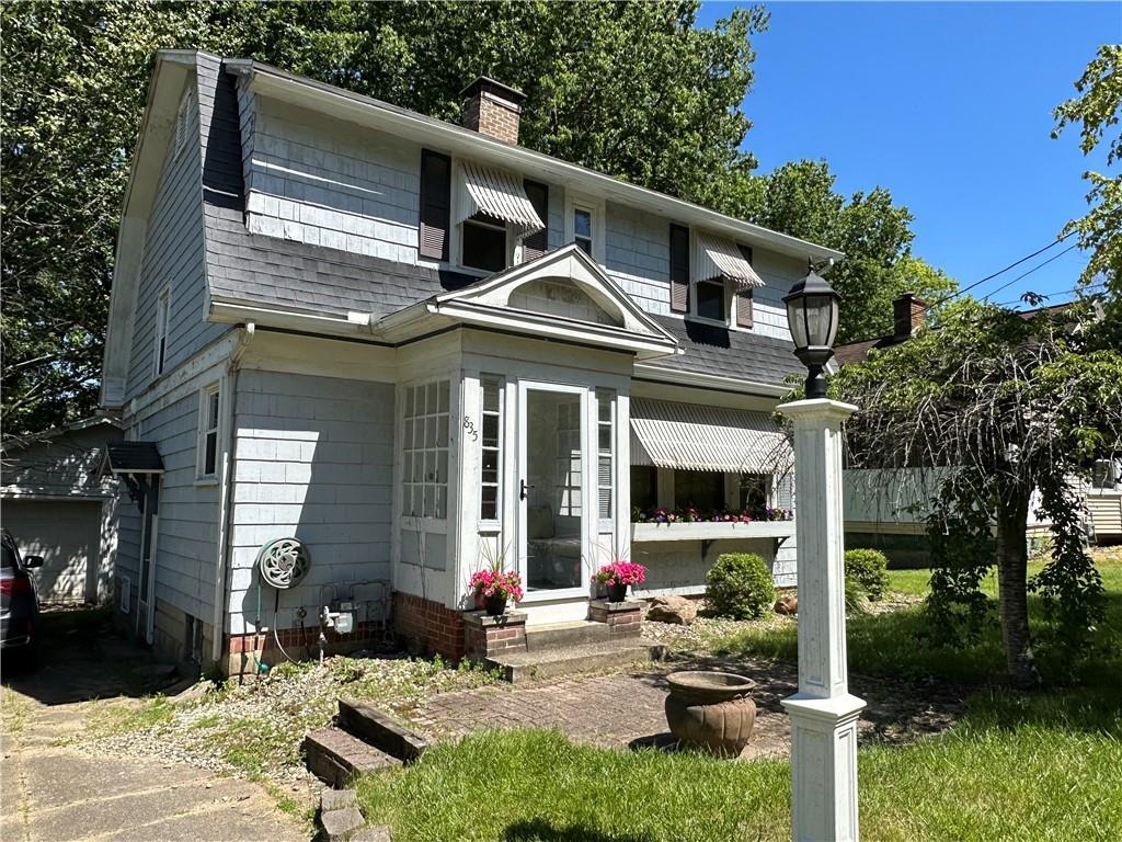 a front view of a house with patio