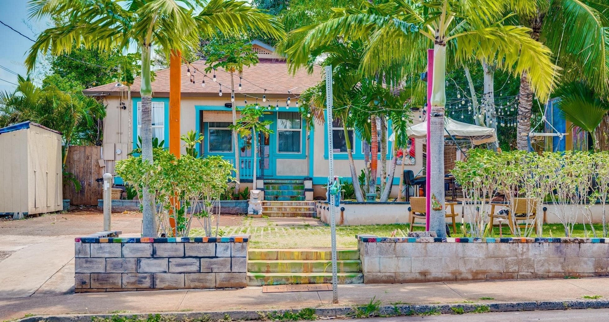 front view of a house with a garden