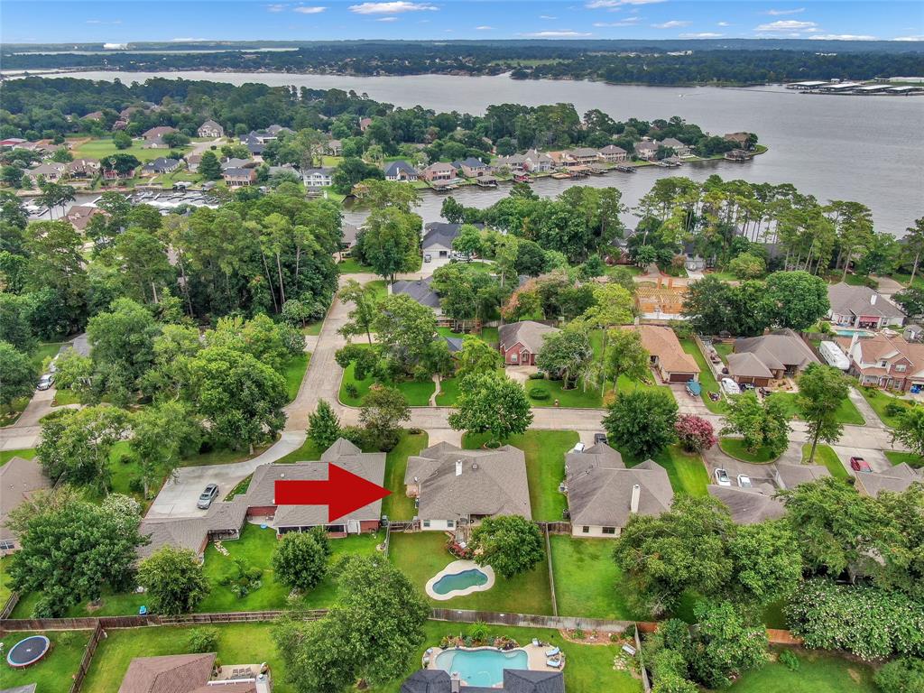 an aerial view of residential house with outdoor space and lake view