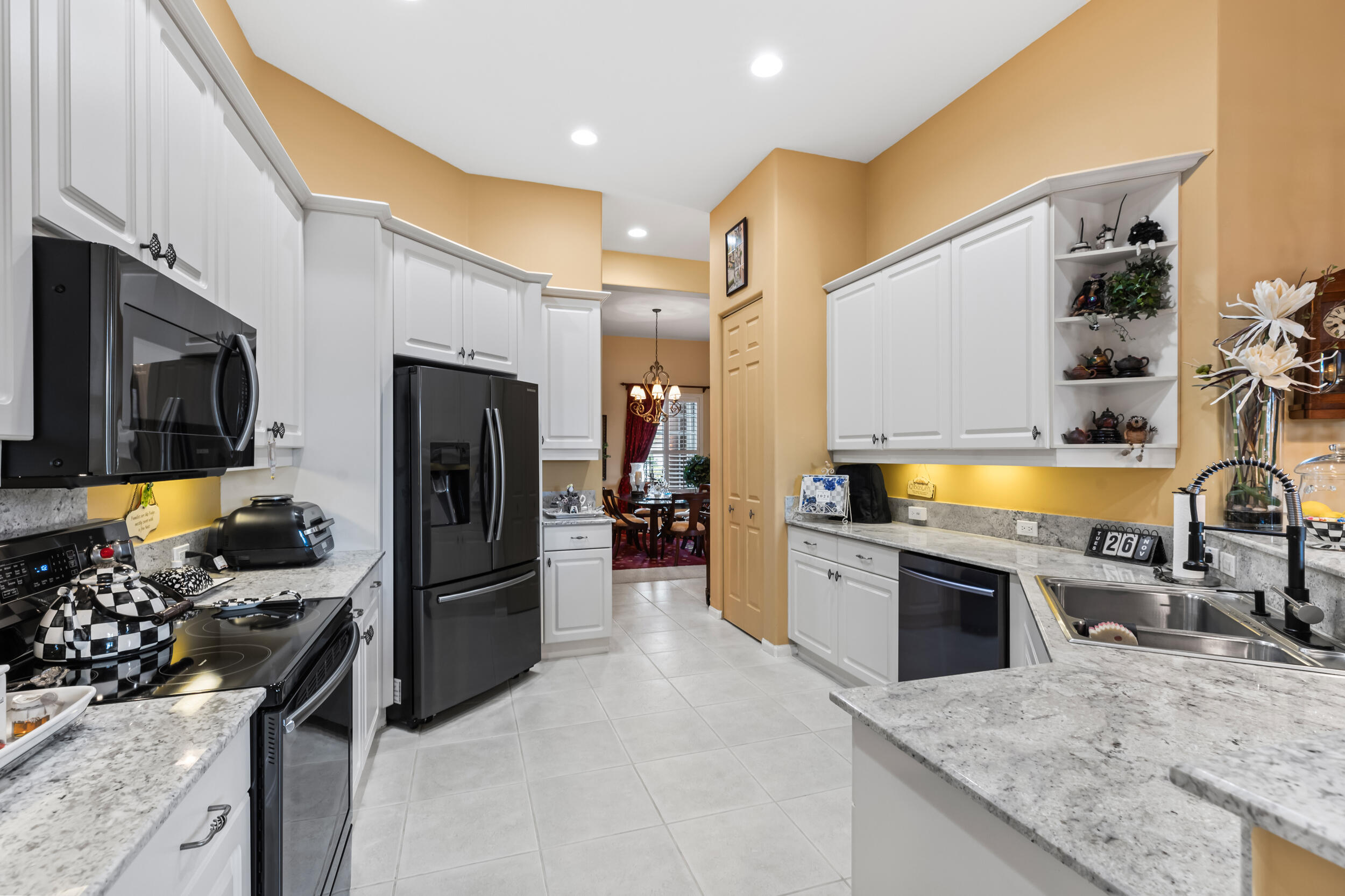 a kitchen with a sink stove and refrigerator