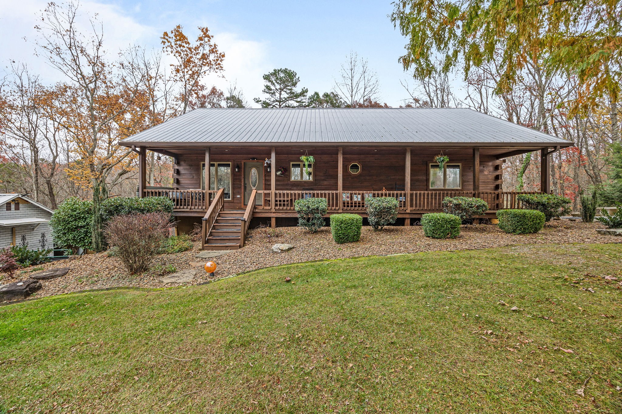 a front view of a house with garden