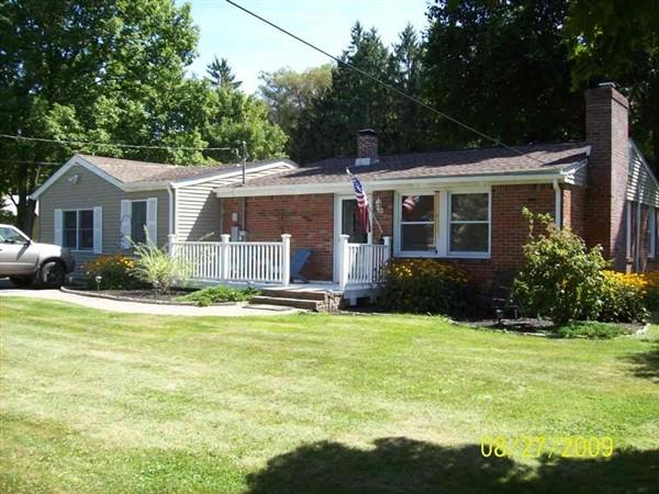 Single story home featuring a front yard