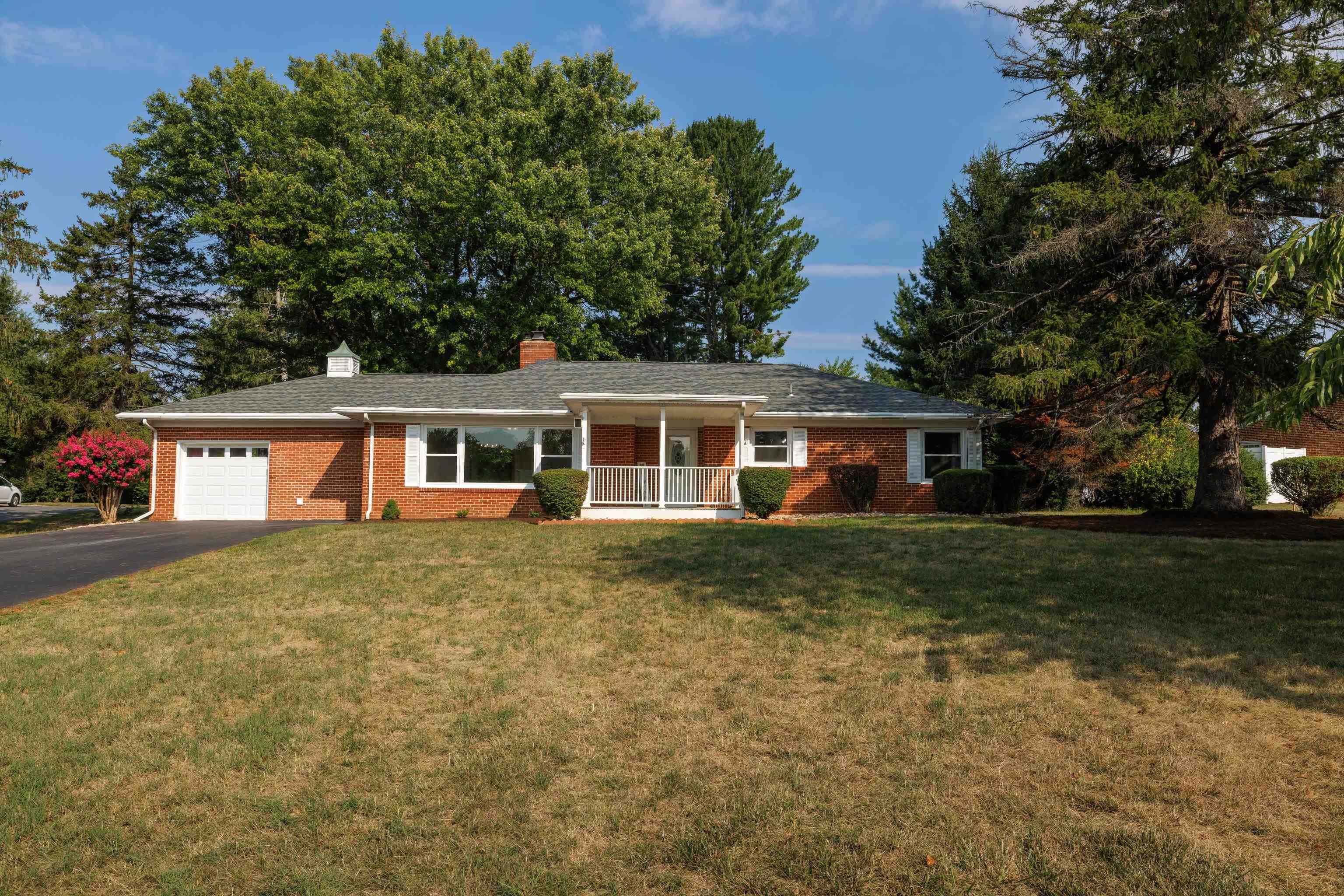 a front of a house with a garden