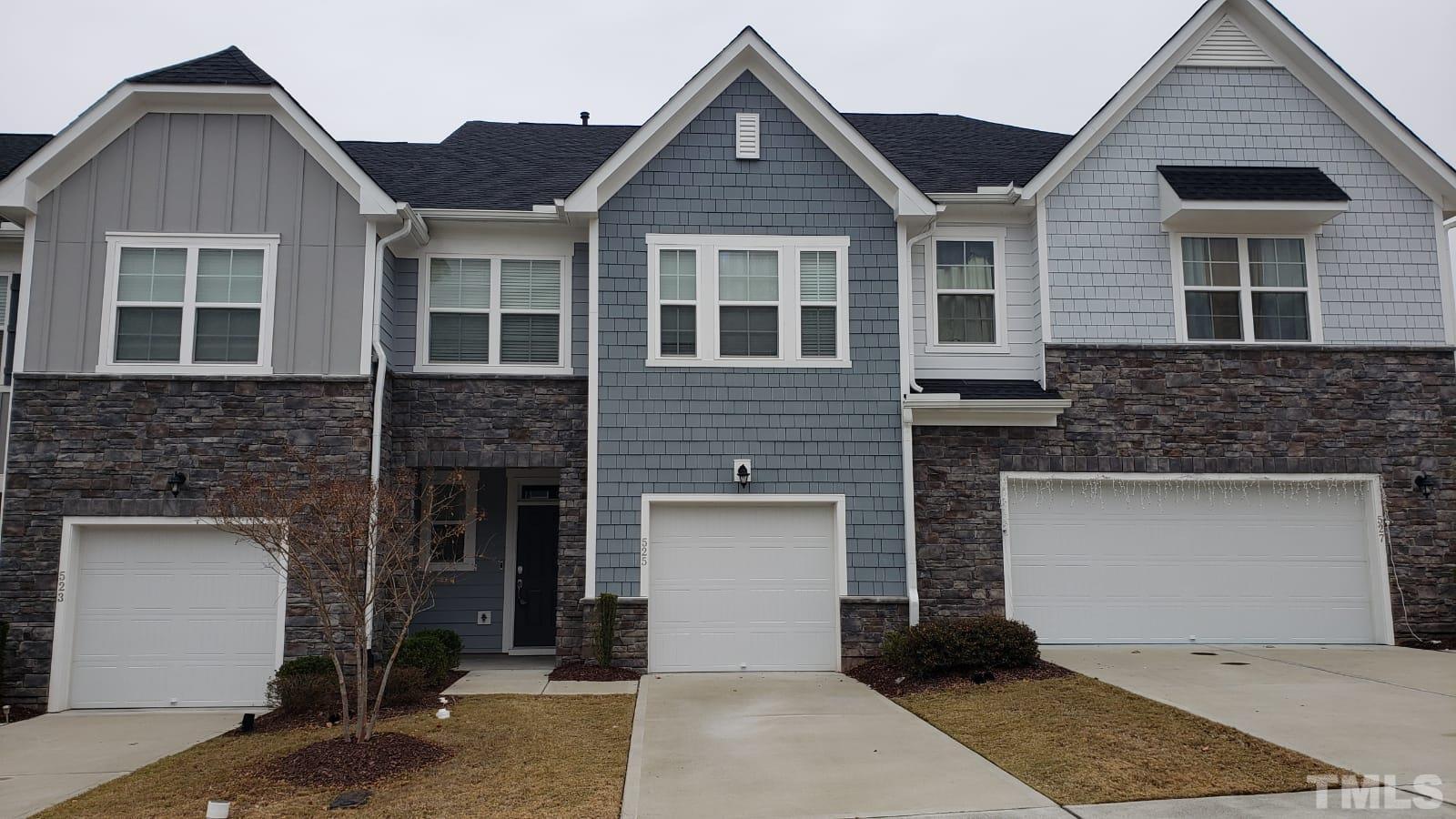 a front view of a house with a garage