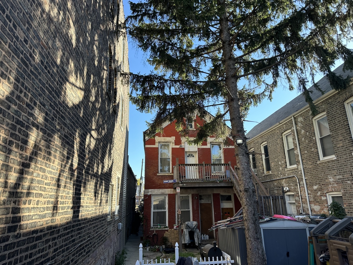 a view of a house with a tree