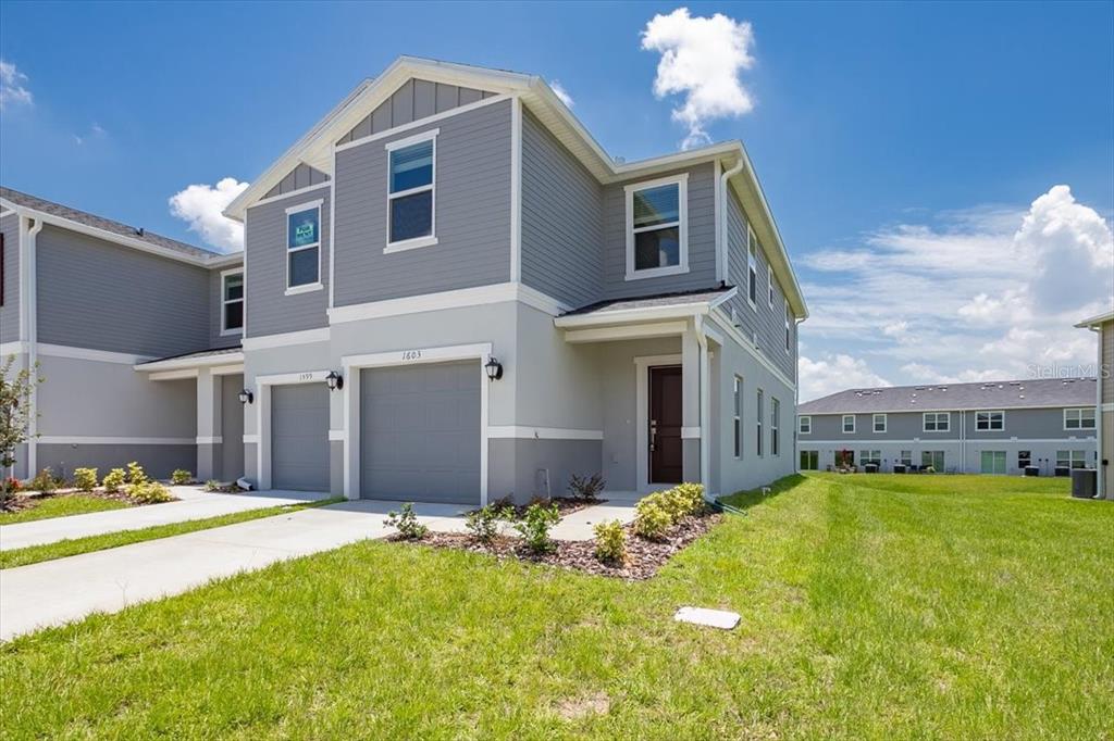 a front view of a house with a yard