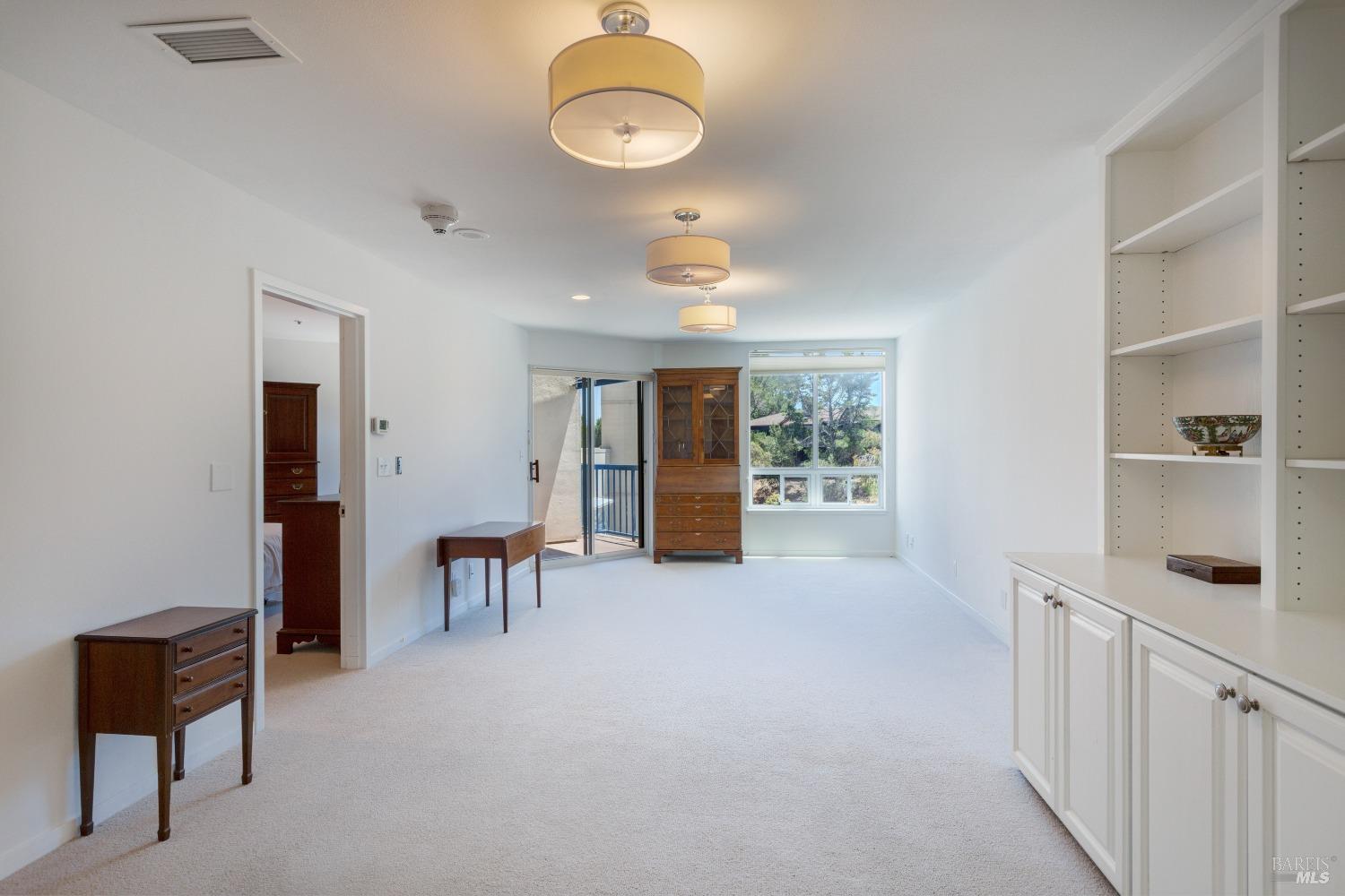 Top of the world with privacy and quiet—living area with the bedroom and balcony to the left.