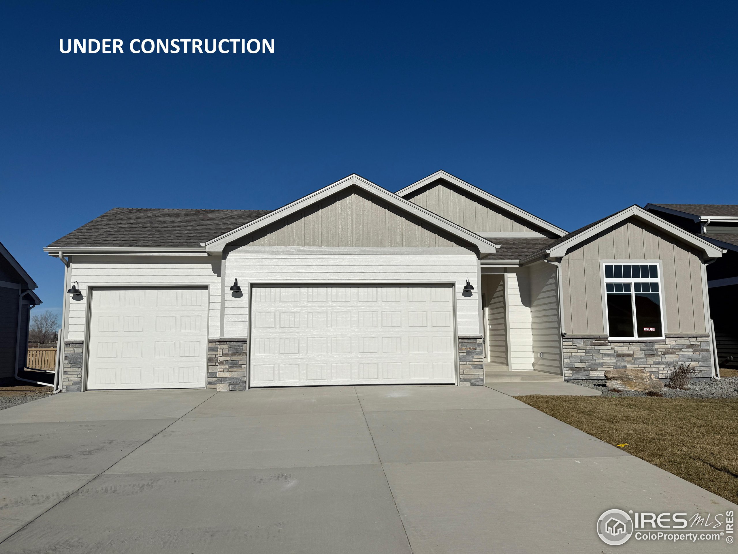 a front view of a house with garage