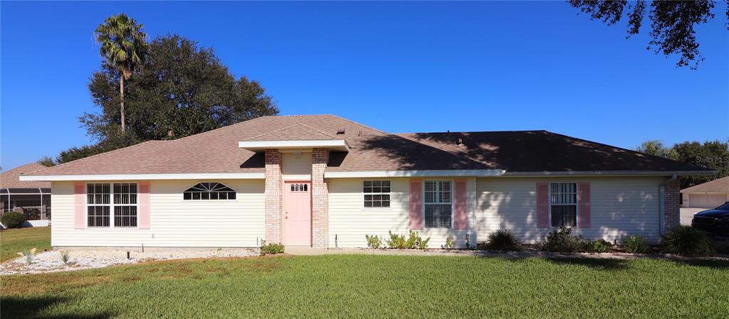 a front view of a house with a yard and porch