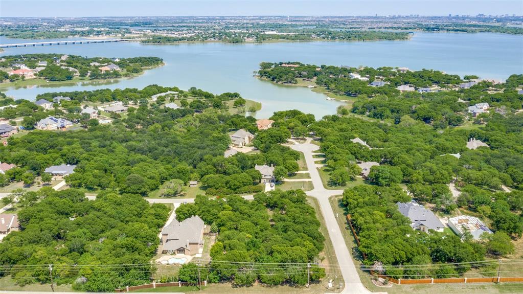 an aerial view of a houses with outdoor space and lake view