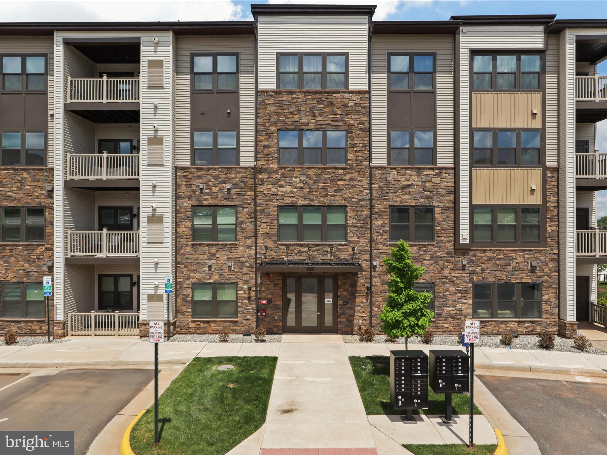 a view of a building with a yard and outdoor space