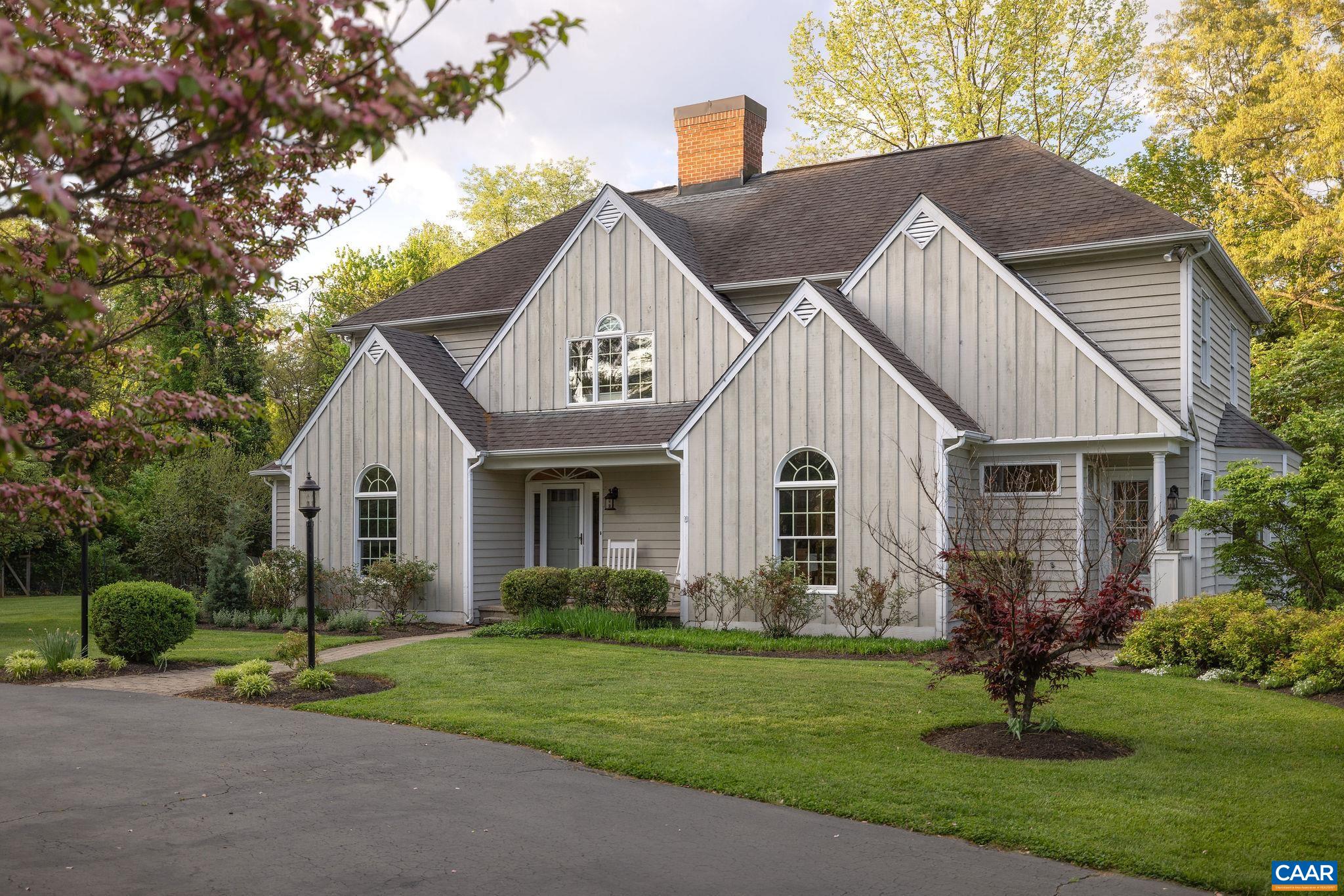 a view of a house with a yard and plants