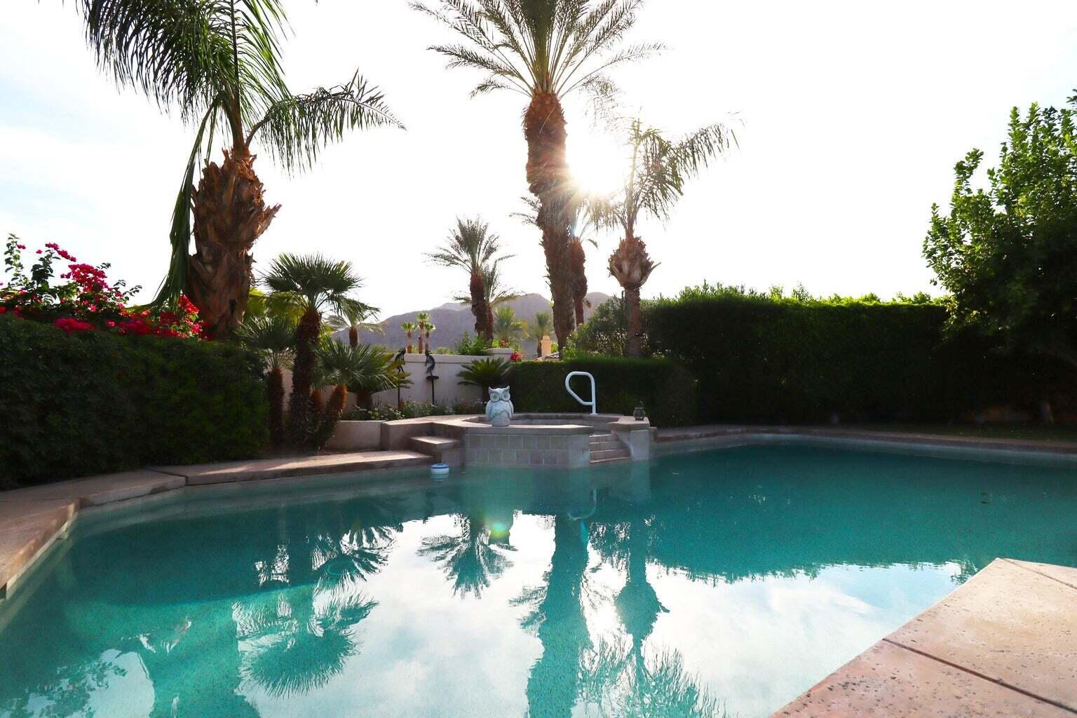 a view of swimming pool with a yard