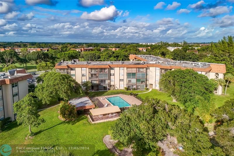 an aerial view of a house with a garden