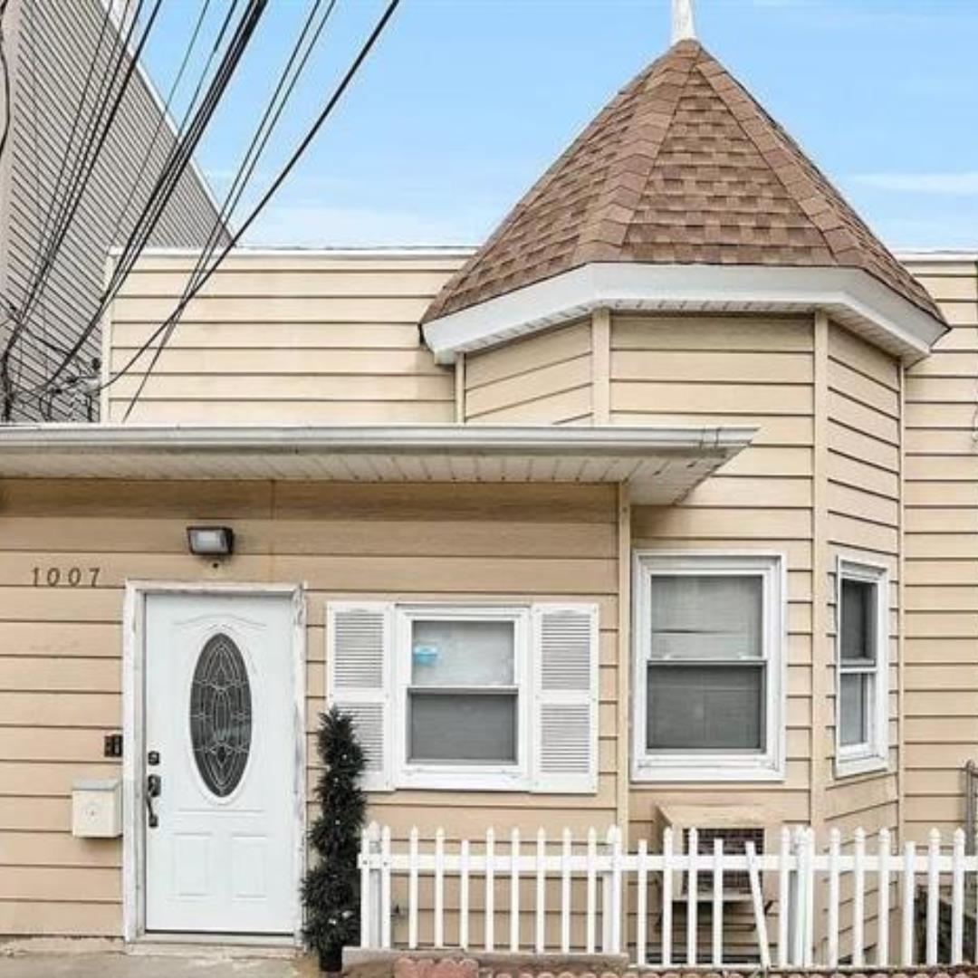 a view of a house with a door and a door