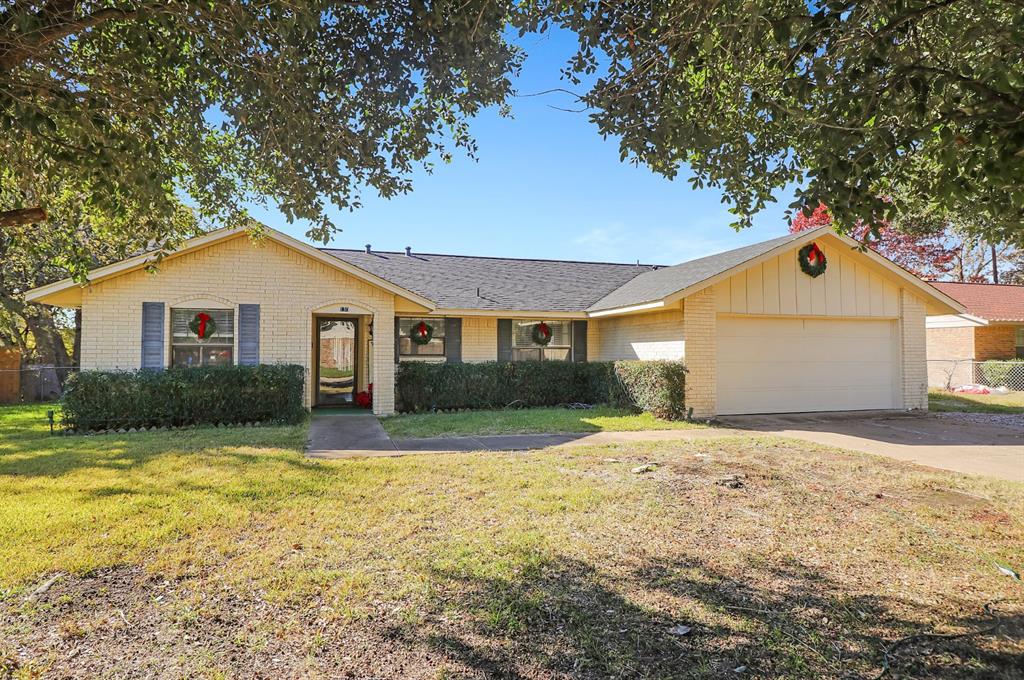 a front view of a house with yard