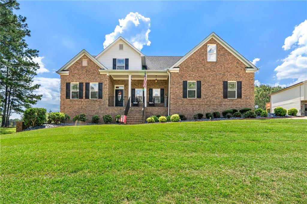 a front view of a house with a yard