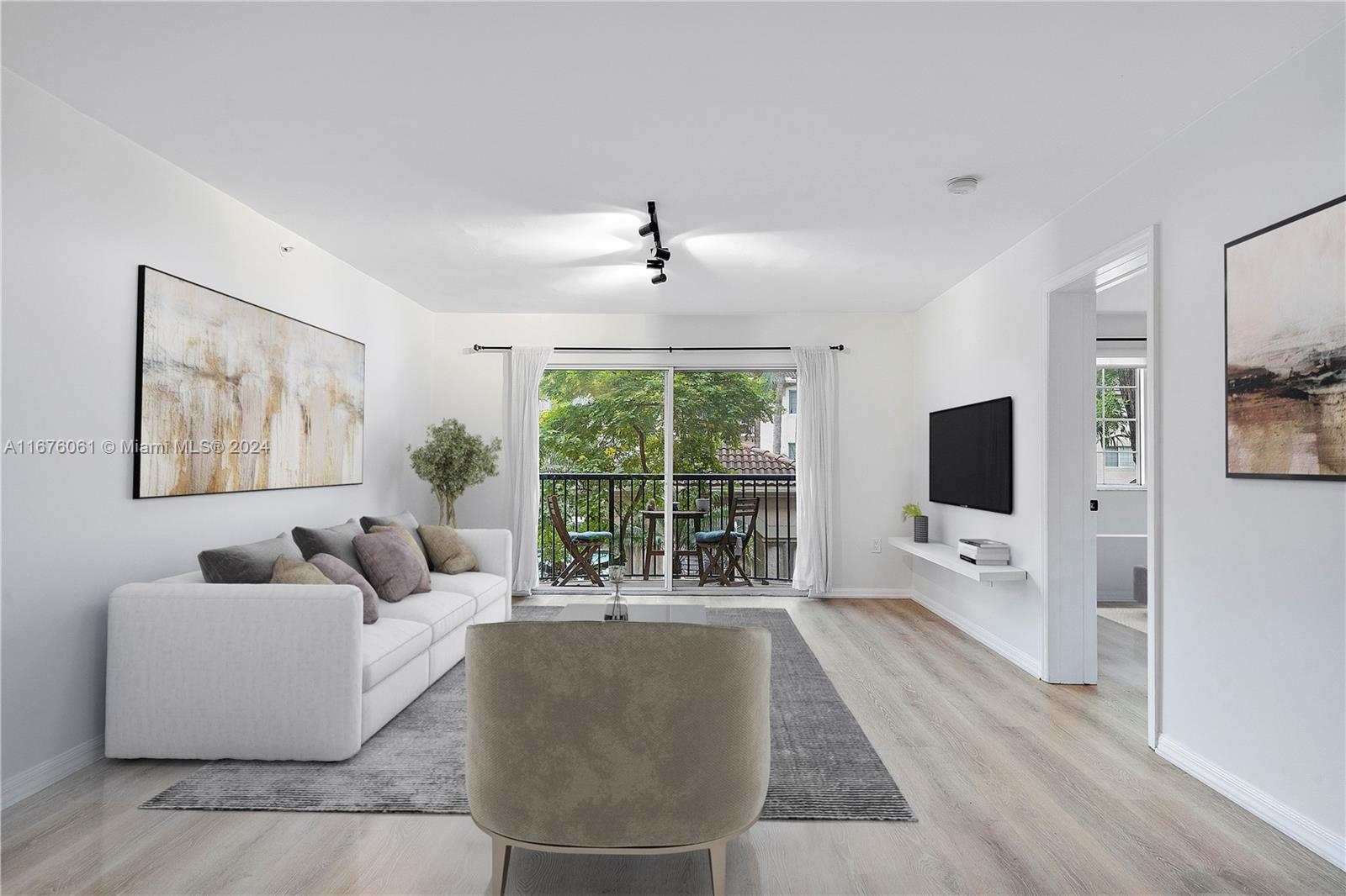 a living room with furniture large windows and a flat screen tv