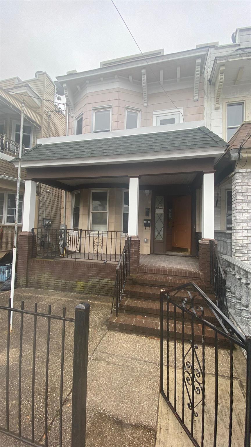 a front view of a house with a porch