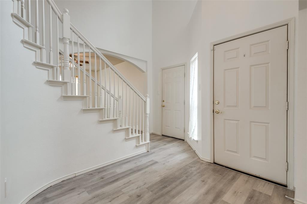 a view of entryway with wooden floor