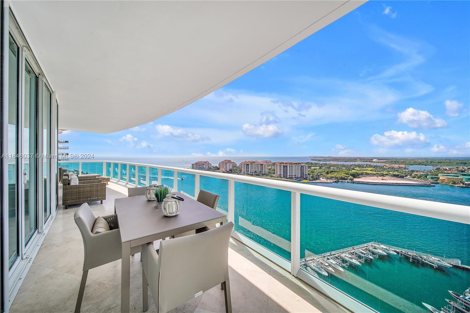 a view of a balcony with a table and chairs