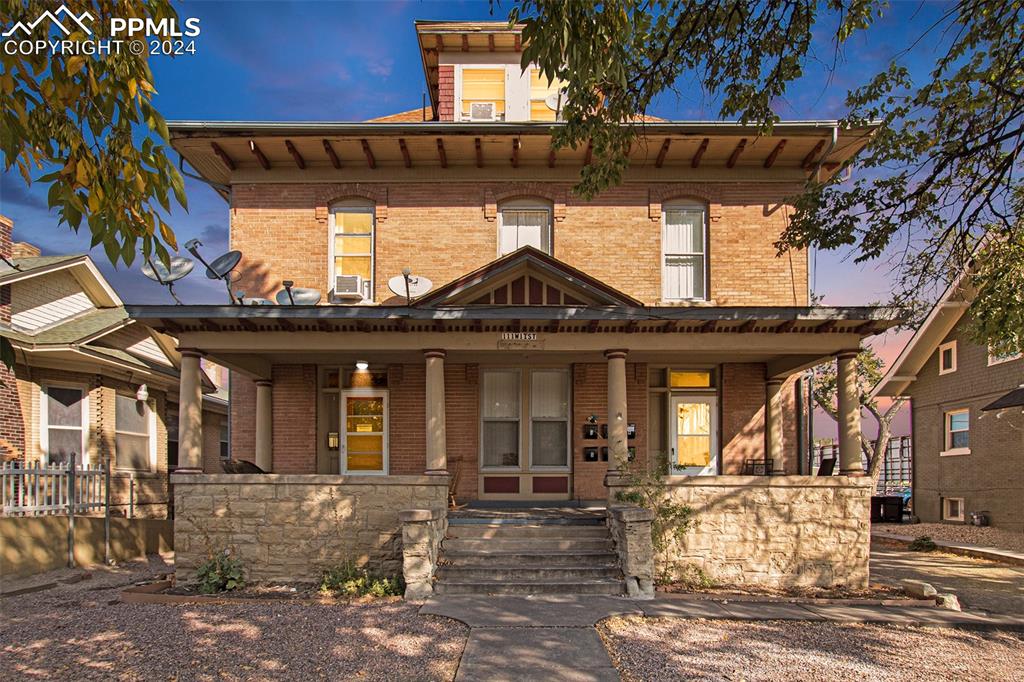 a front view of a house with a porch