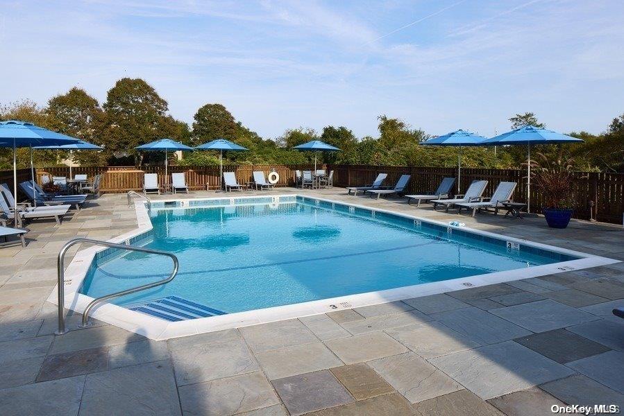 a view of swimming pool with outdoor seating