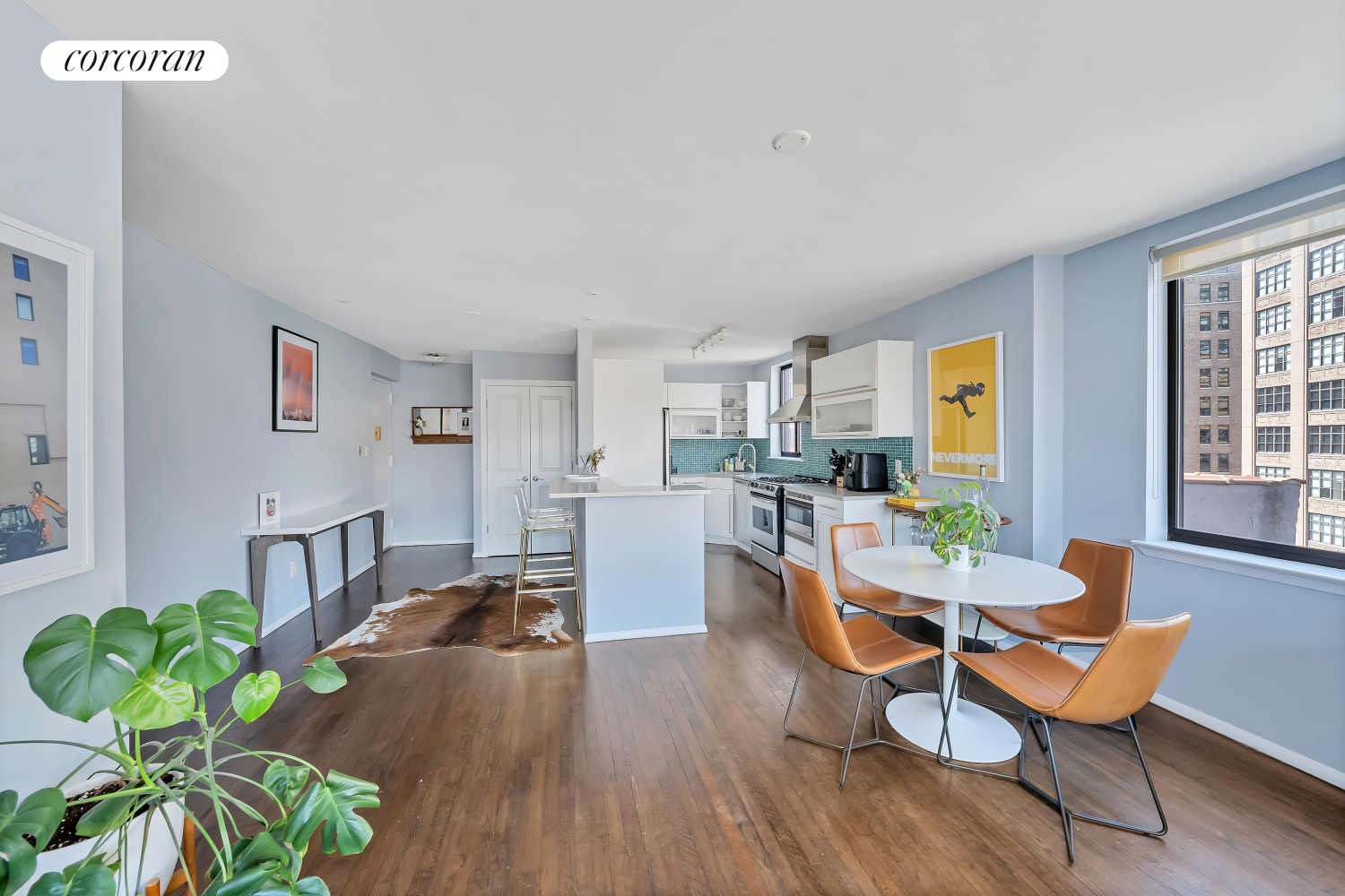 a living room with furniture dining table and a potted plant